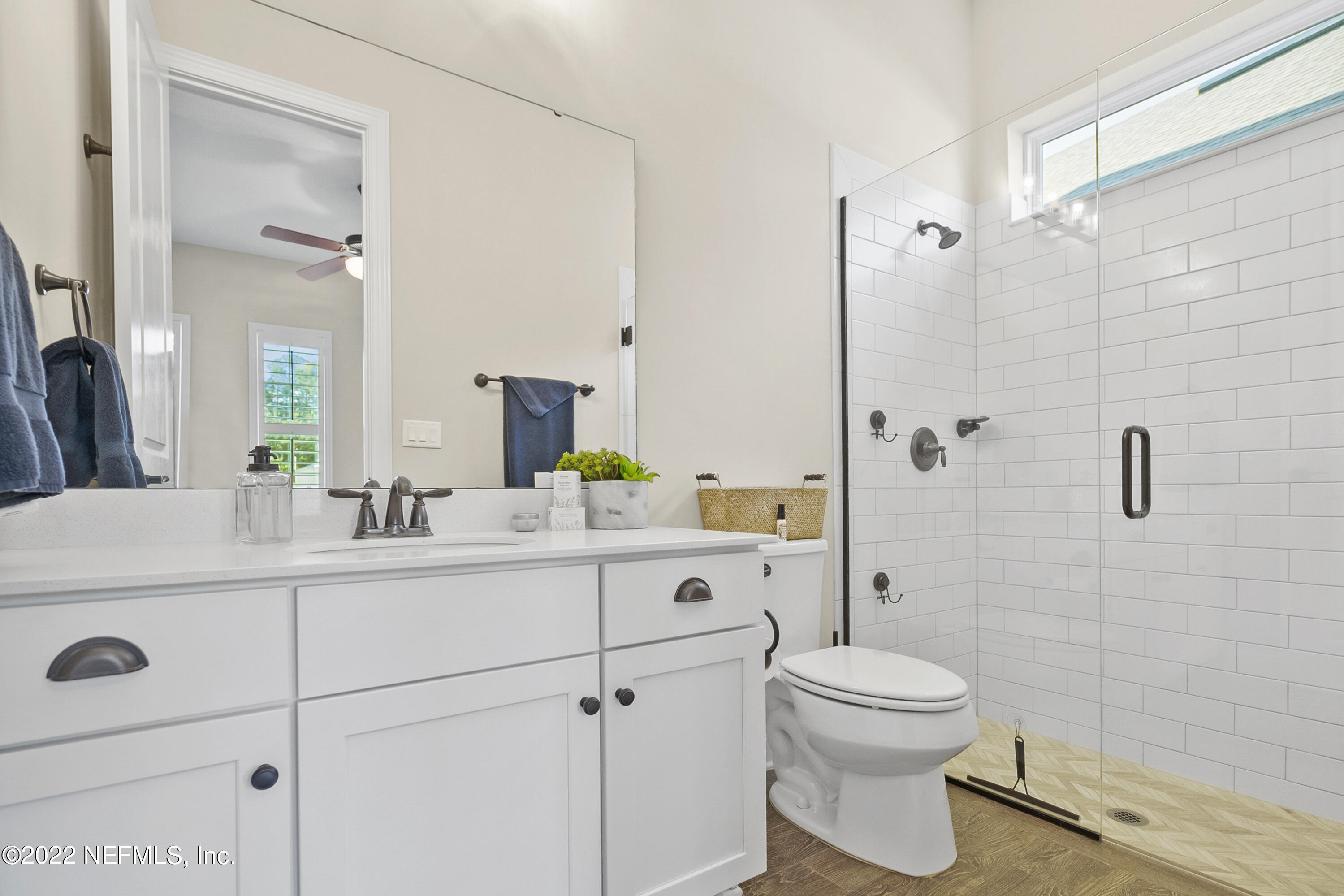 126 Broadleaf Lane St. Johns, FL 32259 - Photo 34 of 70 a bathroom with a sink a toilet and shower