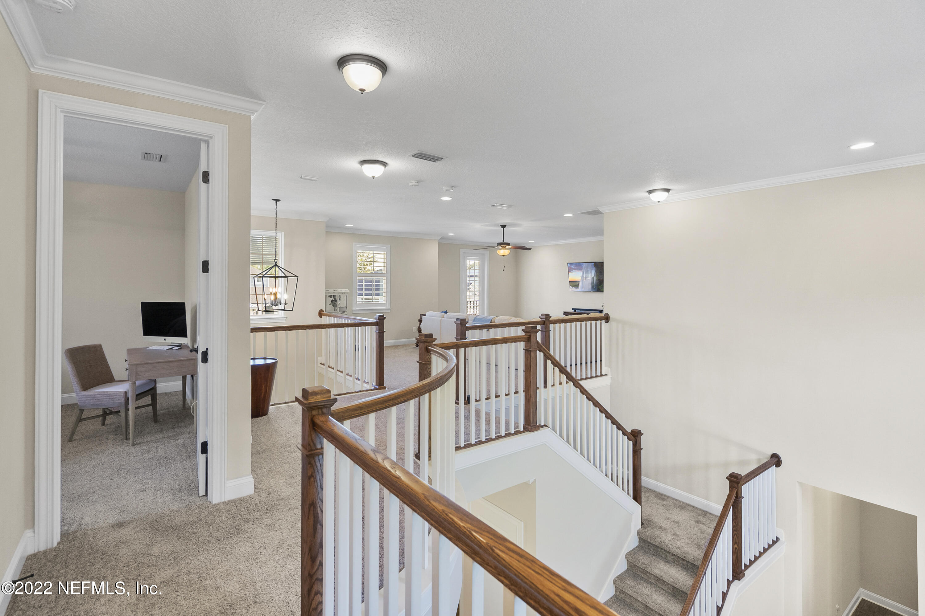 126 Broadleaf Lane St. Johns, FL 32259 - Photo 37 of 70 a view of a hallway with dining room and furniture