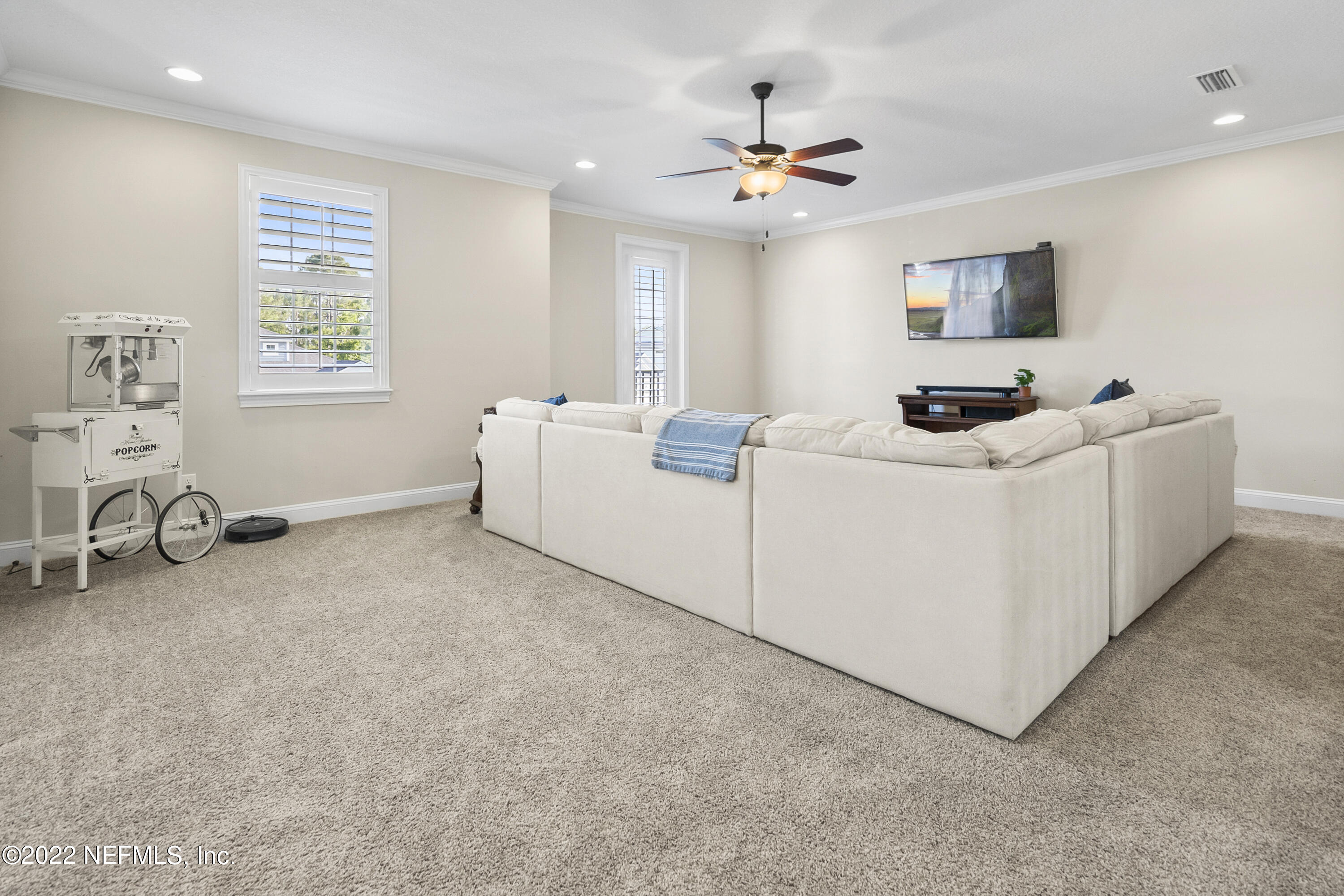 126 Broadleaf Lane St. Johns, FL 32259 - Photo 38 of 70 a living room with furniture and a flat screen tv
