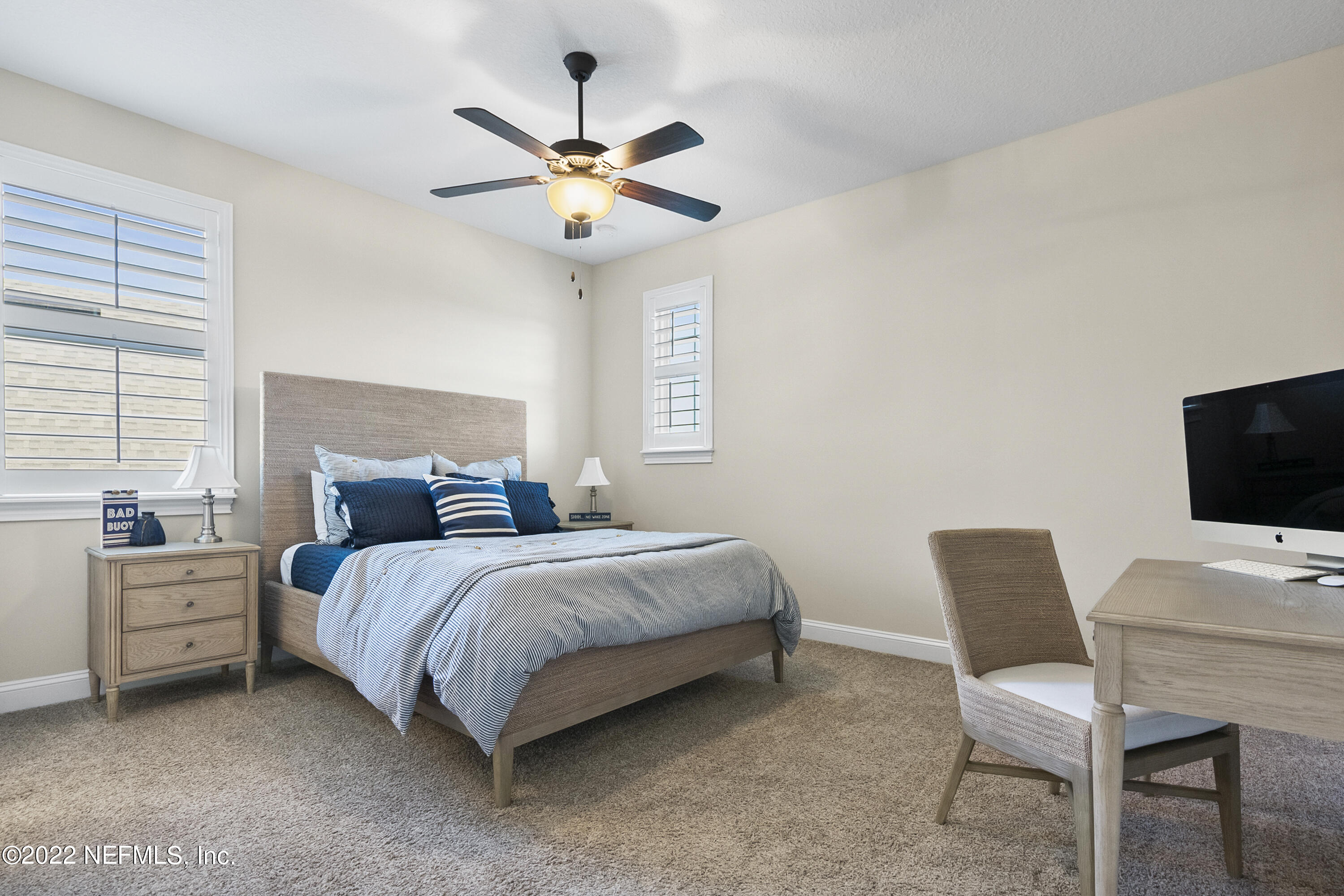 126 Broadleaf Lane St. Johns, FL 32259 - Photo 40 of 70 a bedroom with a bed window and a chair