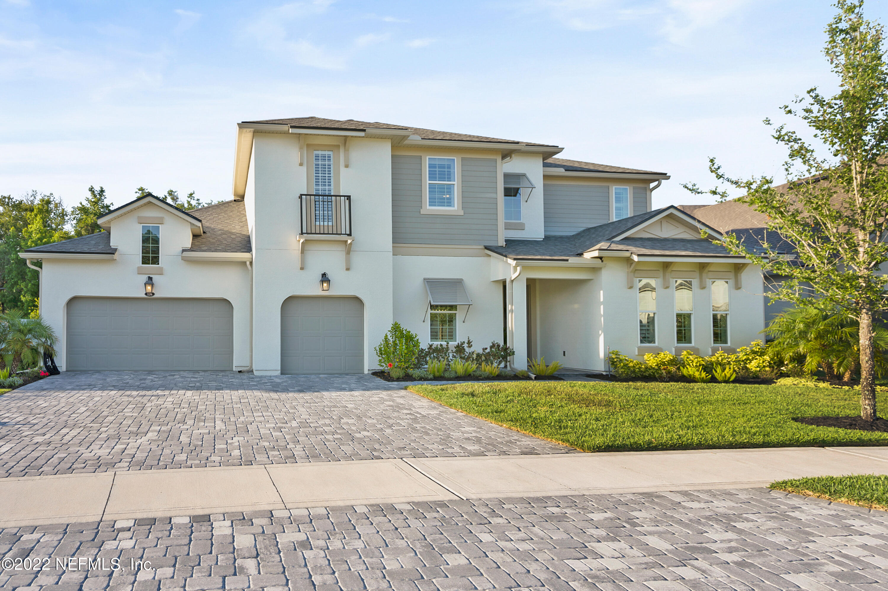 126 Broadleaf Lane St. Johns, FL 32259 - Photo 44 of 70 a front view of a house with a yard and garage