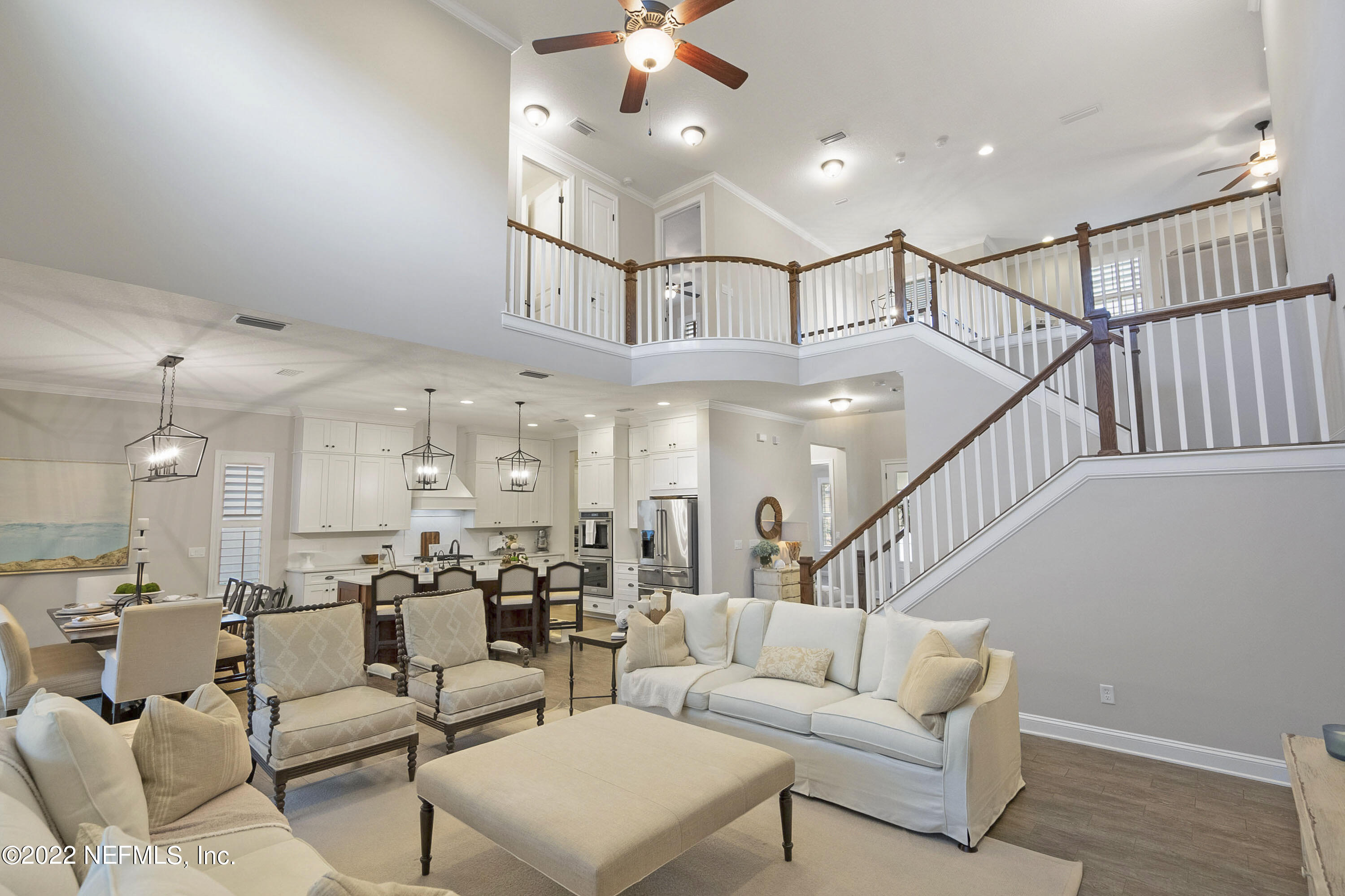 126 Broadleaf Lane St. Johns, FL 32259 - Photo 5 of 70 a living room with lots of furniture and a view of kitchen