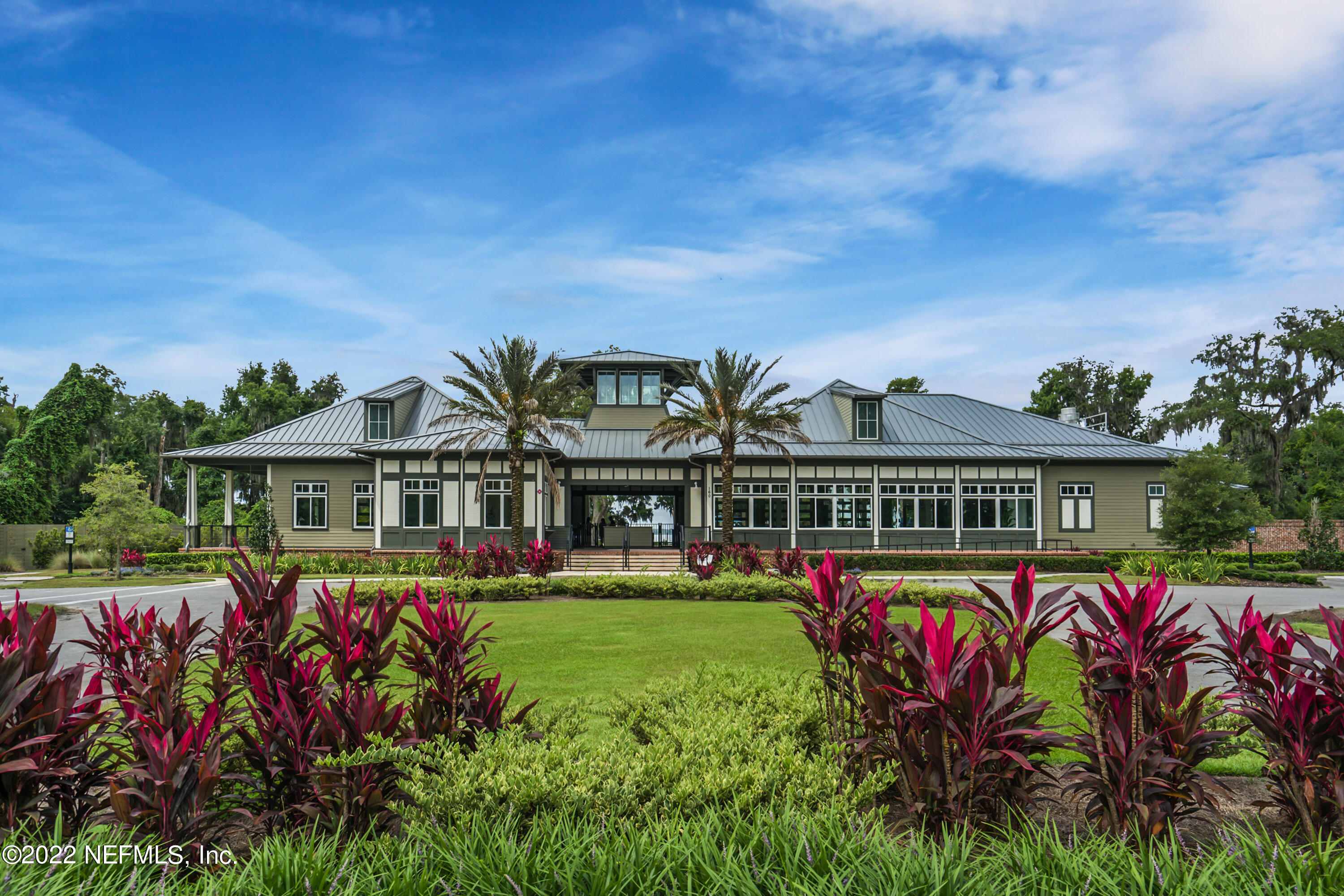 126 Broadleaf Lane St. Johns, FL 32259 - Photo 58 of 70 front view of a house with a big yard and potted plants