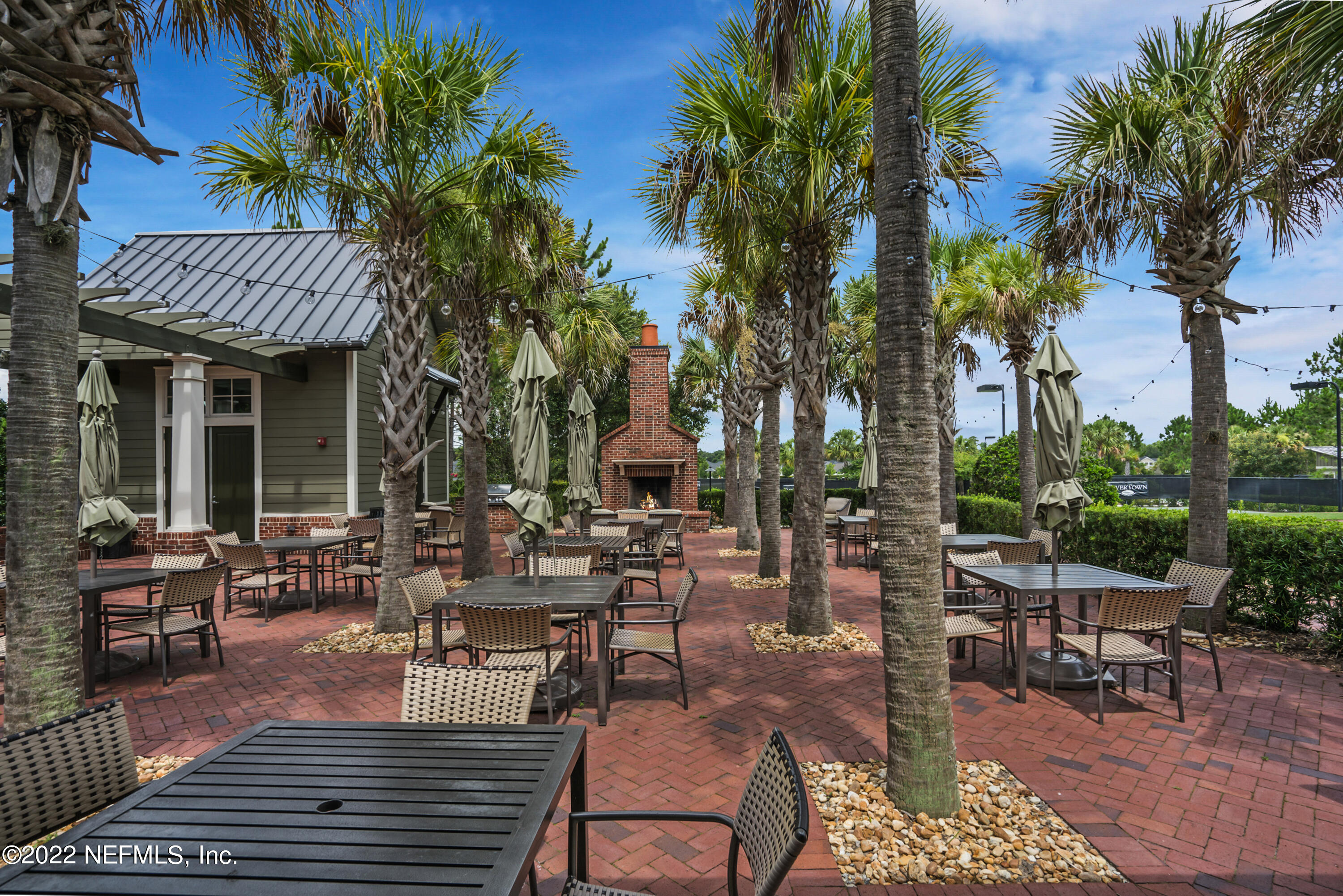 126 Broadleaf Lane St. Johns, FL 32259 - Photo 68 of 70 a view of a patio with chairs and tables