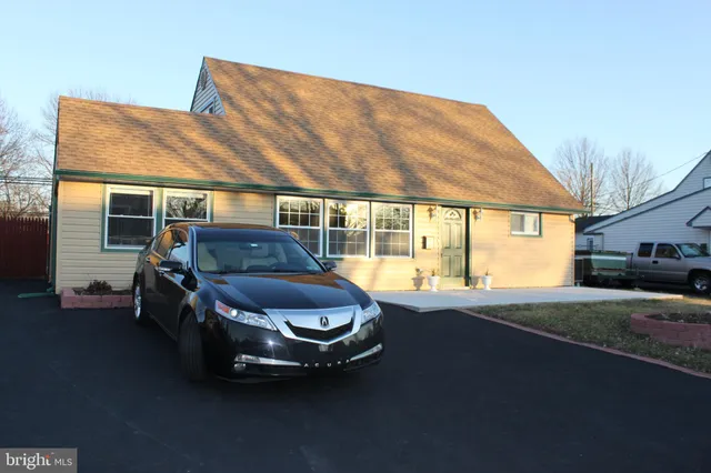 a room with pool table and windows