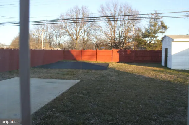 a view of a back yard from a balcony