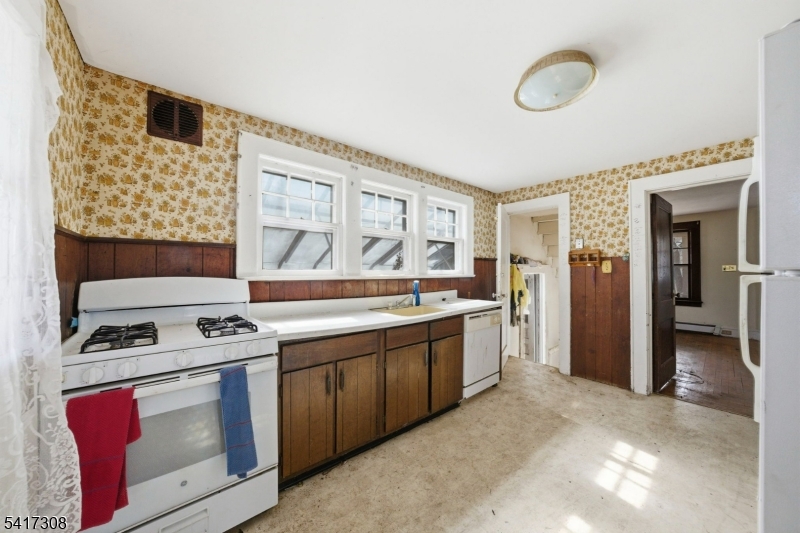 610 Watchung Road Bound Brook, NJ 08805 - Photo 26 of 45 a kitchen with stainless steel appliances granite countertop a stove and a sink