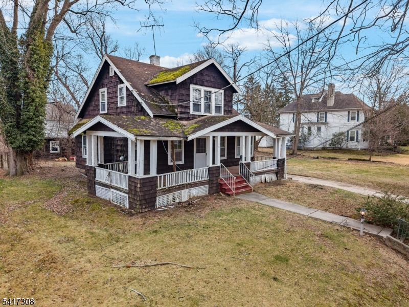 610 Watchung Road Bound Brook, NJ 08805 - Photo 3 of 45 a view of a house with a yard and wooden fence