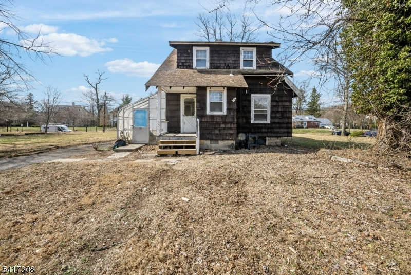 610 Watchung Road Bound Brook, NJ 08805 - Photo 31 of 45 a front view of a house with a yard