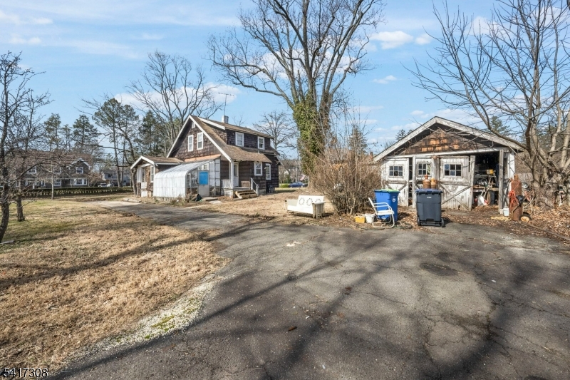 610 Watchung Road Bound Brook, NJ 08805 - Photo 32 of 45 a front view of a house with a yard