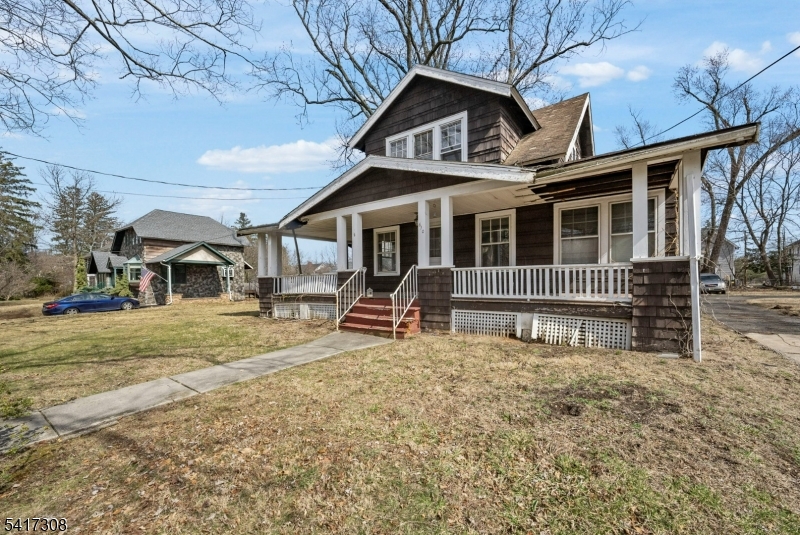 610 Watchung Road Bound Brook, NJ 08805 - Photo 39 of 45 a view of a house with a large window and wooden fence