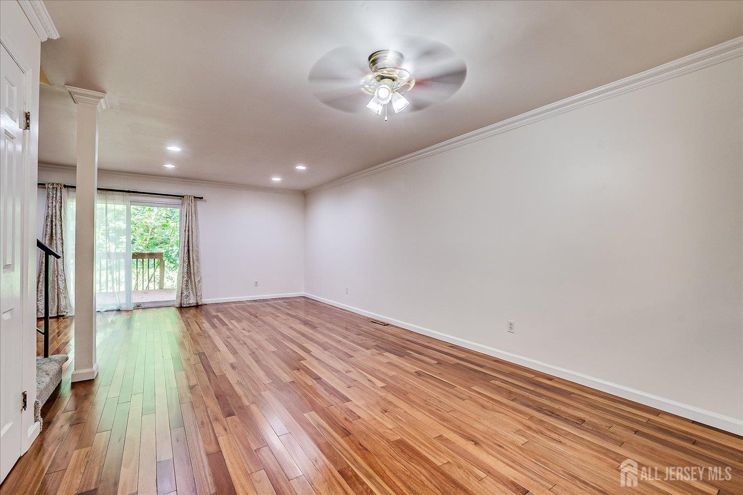 6 Tulip Court Edison, NJ 08820 - Photo 16 of 46 wooden floor in an empty room with a window