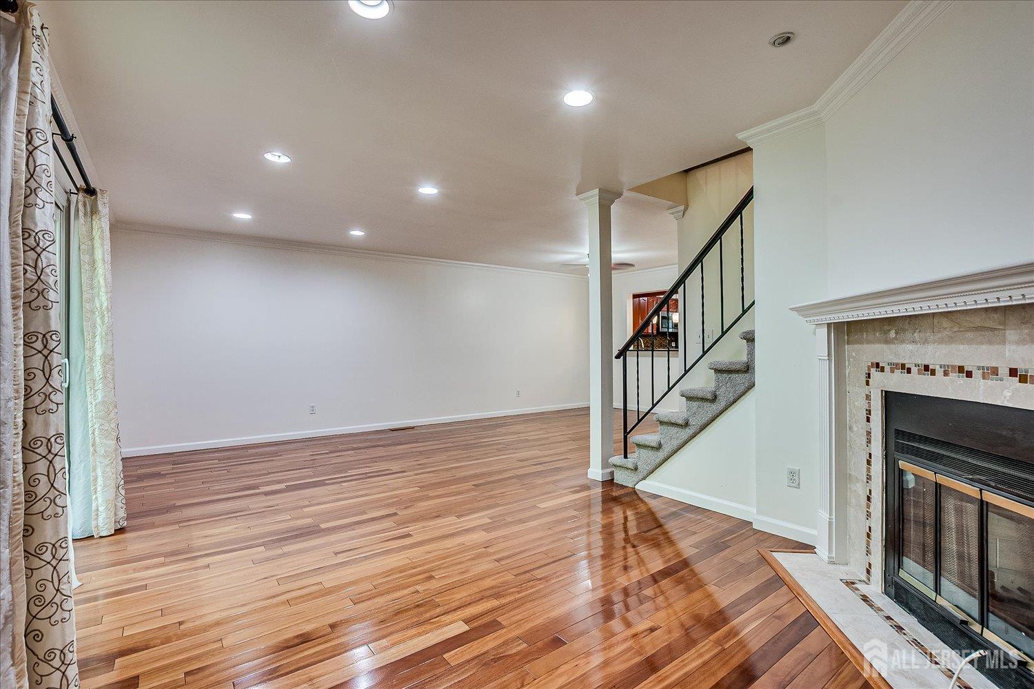 6 Tulip Court Edison, NJ 08820 - Photo 20 of 46 a view of entryway and hall with wooden floor