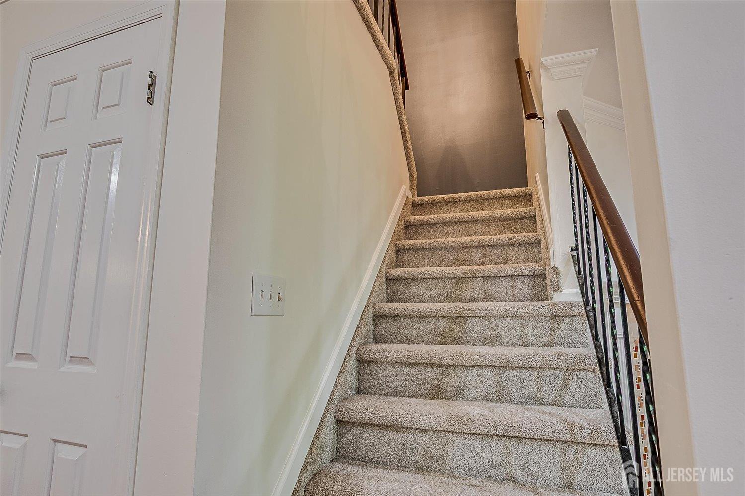 6 Tulip Court Edison, NJ 08820 - Photo 23 of 46 a view of staircase with white walls and white door
