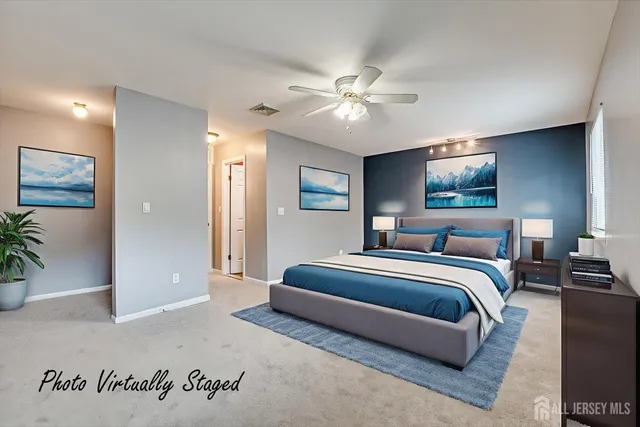 an empty room with closet and a ceiling fan