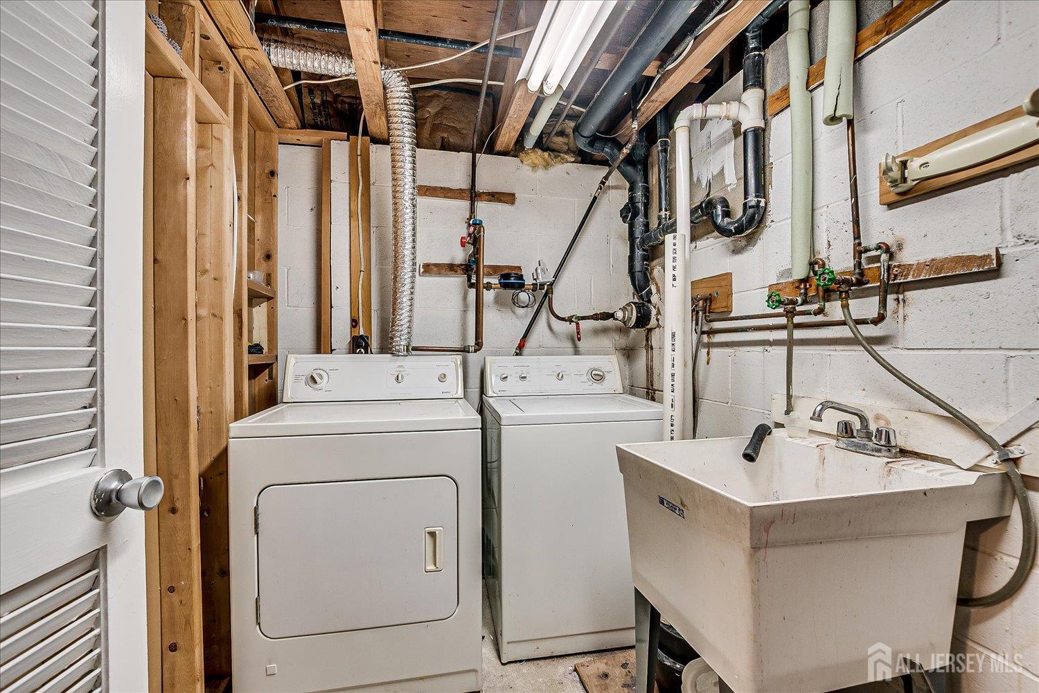 6 Tulip Court Edison, NJ 08820 - Photo 35 of 46 a view of storage and utility room with washer and dryer