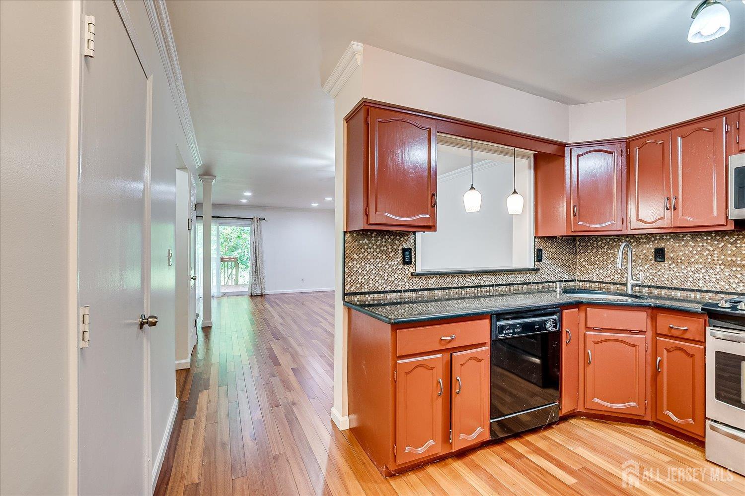 6 Tulip Court Edison, NJ 08820 - Photo 10 of 46 a kitchen with stainless steel appliances granite countertop a stove a sink and a refrigerator