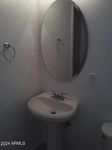 a bathroom with a sink and mirror