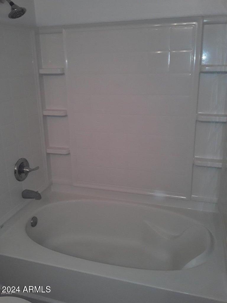1920 East Bell Road, Unit 1103 Phoenix, AZ 85022 - Photo 25 of 29 a close up of a bathtub