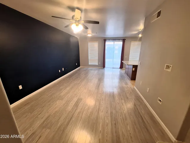 a view of gallery with wooden floor