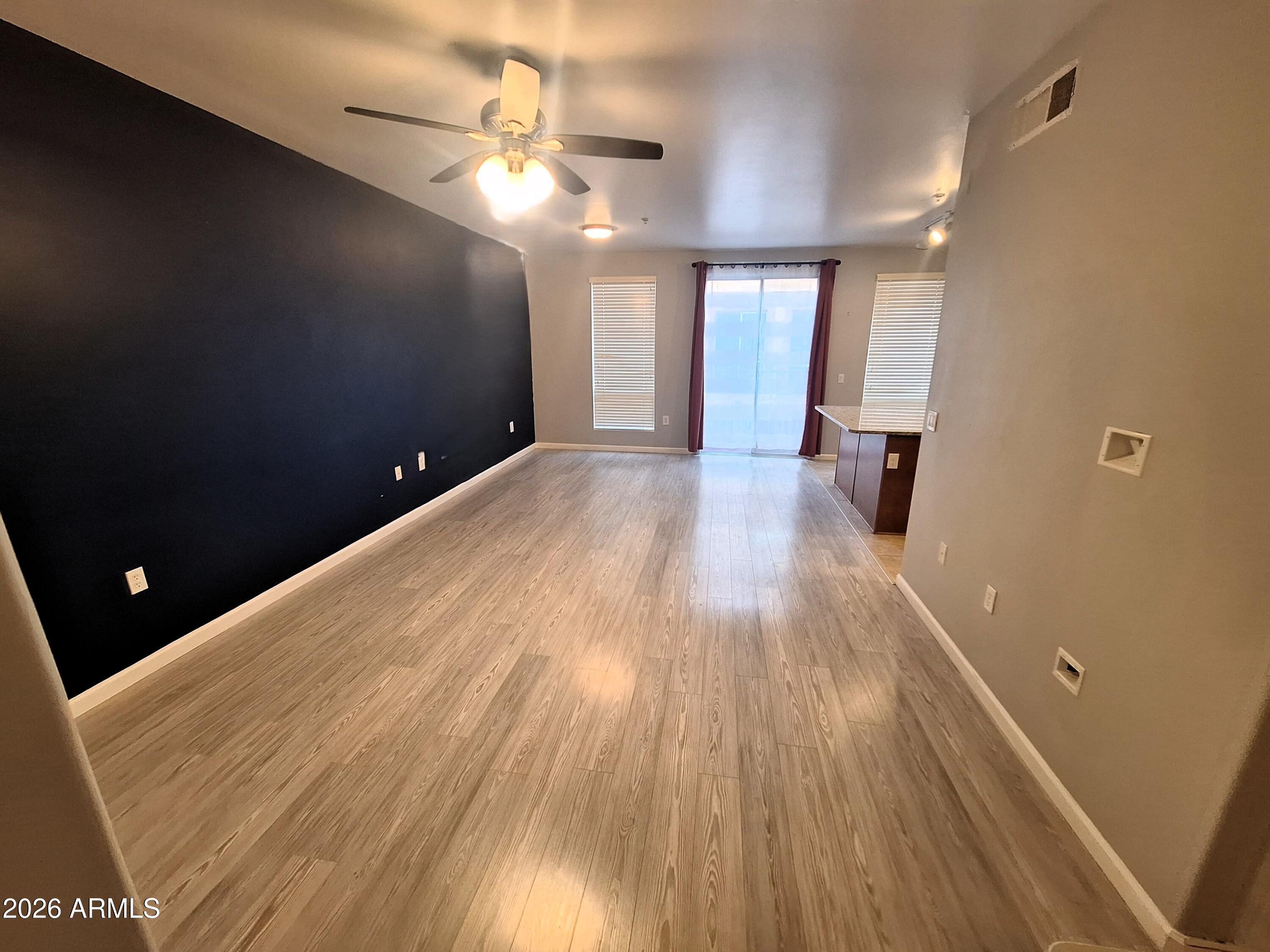 1920 East Bell Road, Unit 1103 Phoenix, AZ 85022 - Photo 7 of 29 a view of gallery with wooden floor