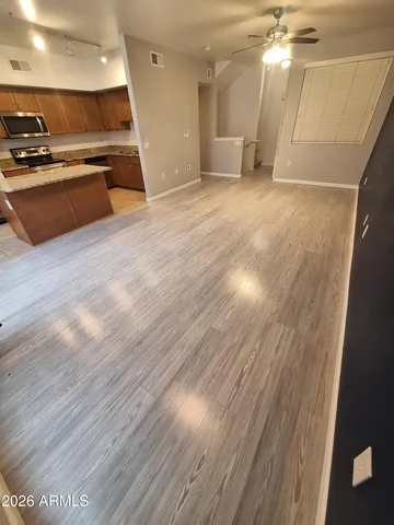 a view of kitchen with wooden floor and a sink