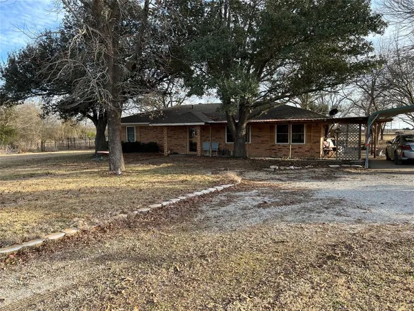 a house with trees in the background