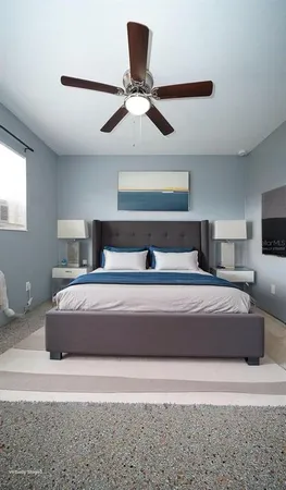 a bedroom with a bed and window