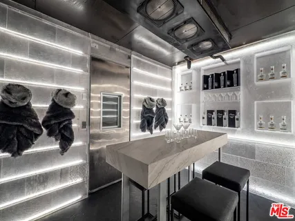 a living room with lots of furniture and clutter