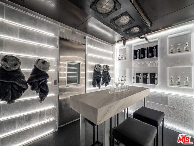 a living room with lots of furniture and clutter