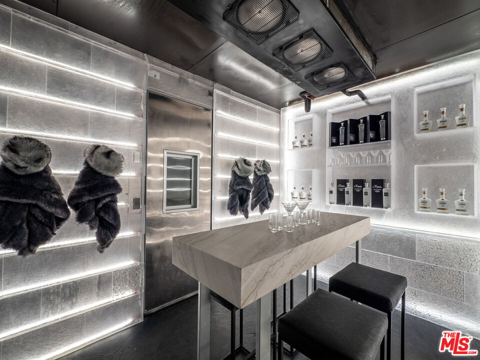 1200 Bel Air Road Los Angeles, CA 90077 - Photo 11 of 27 a view of a dining room with furniture and a chandelier