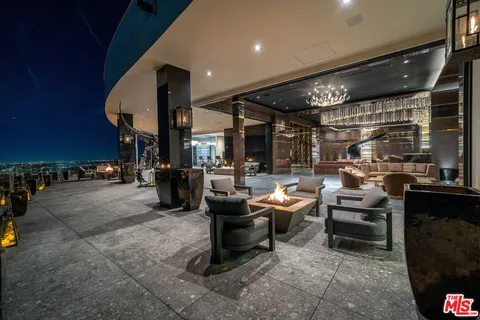 a view of entryway with a hallway and wooden floor