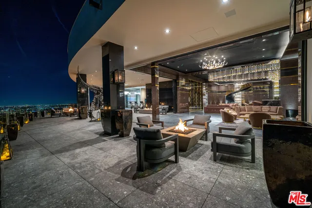 a view of entryway with a hallway and wooden floor