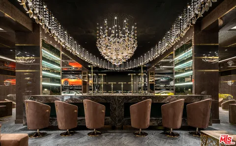 a view of a living room with a sink and dishwasher
