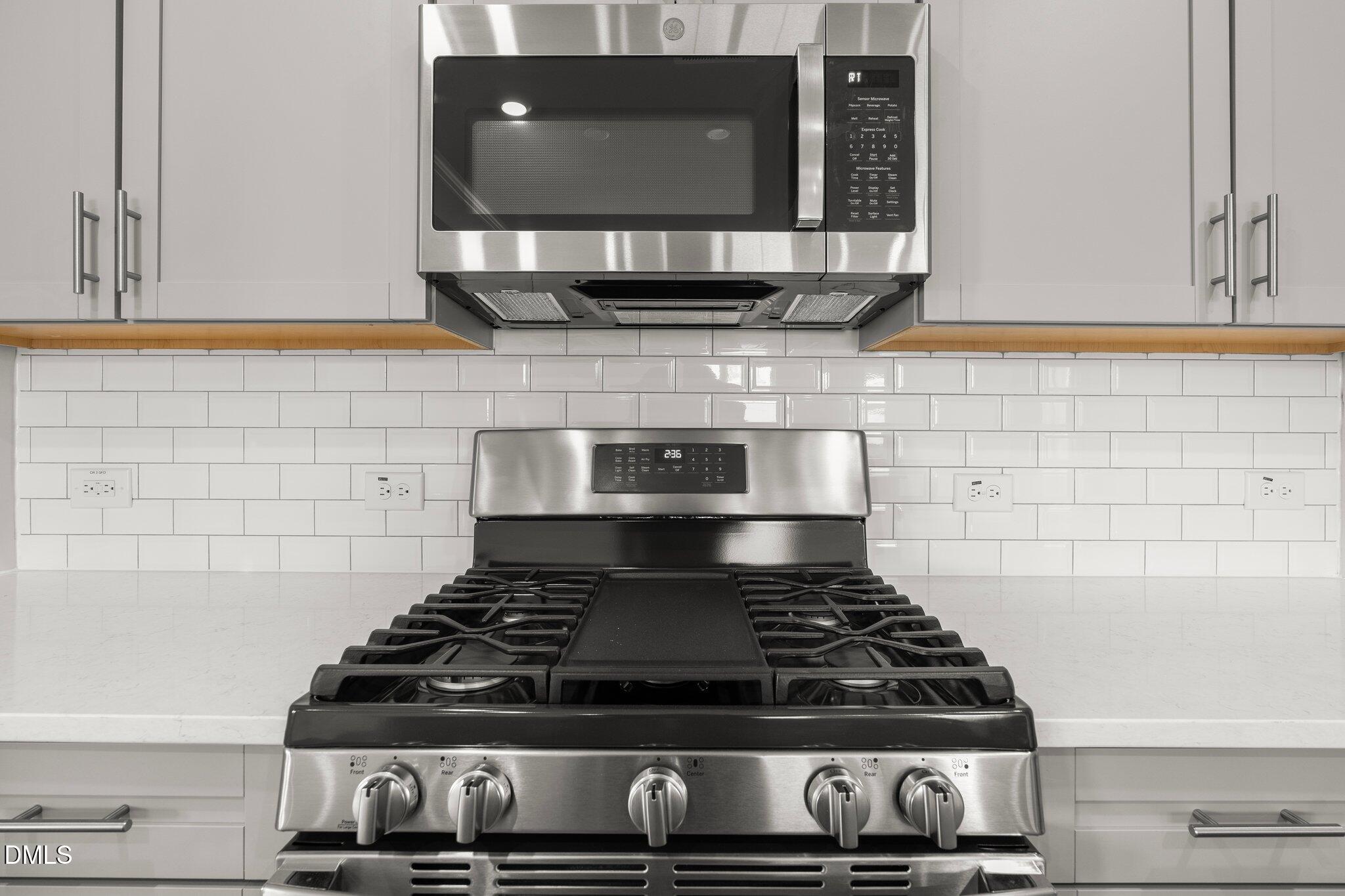 5031 Kota Street Raleigh, NC 27610 - Photo 15 of 84 a stove top oven sitting inside of a kitchen