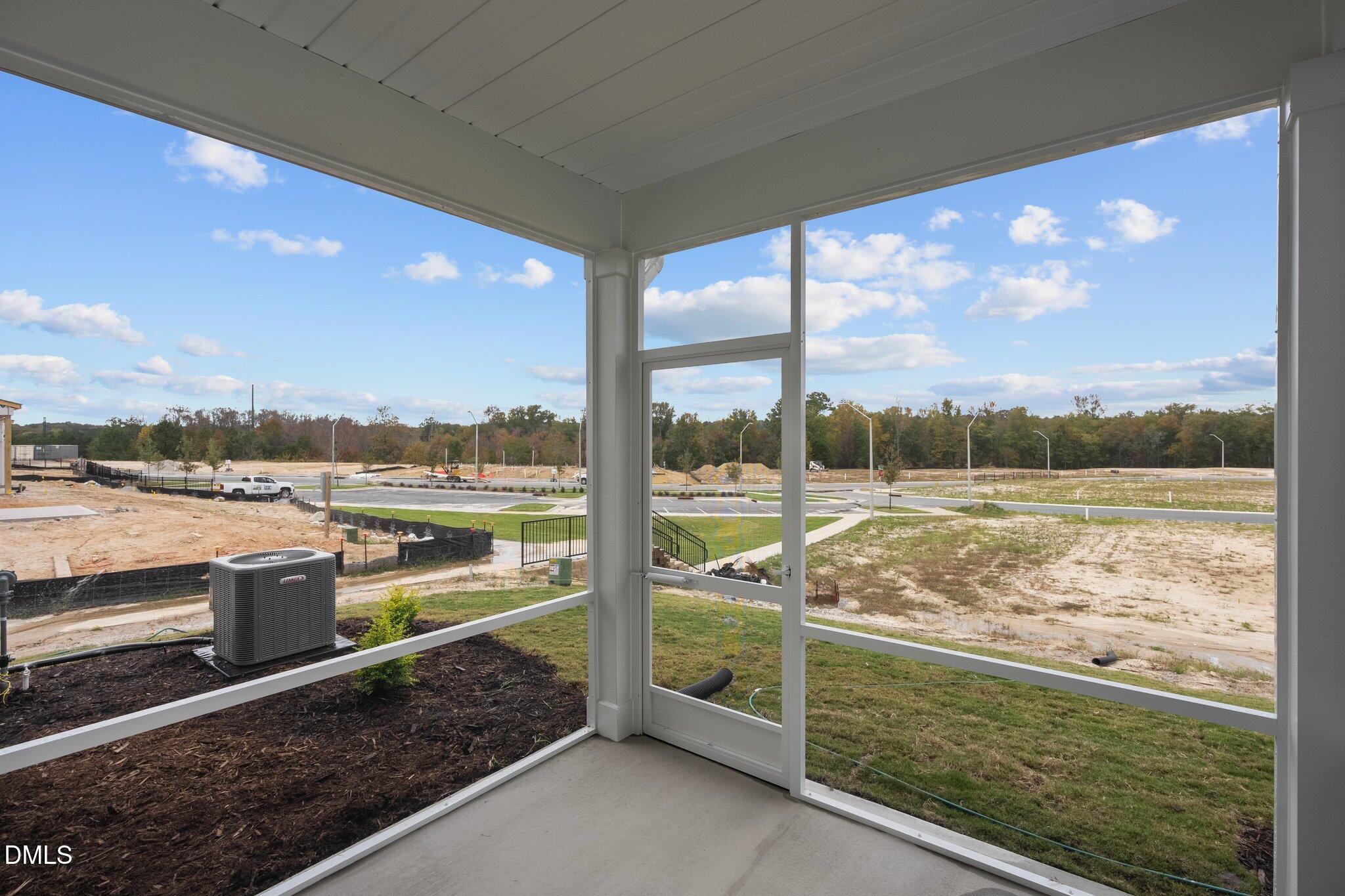 5031 Kota Street Raleigh, NC 27610 - Photo 20 of 84 a view of a lake from a balcony with city view