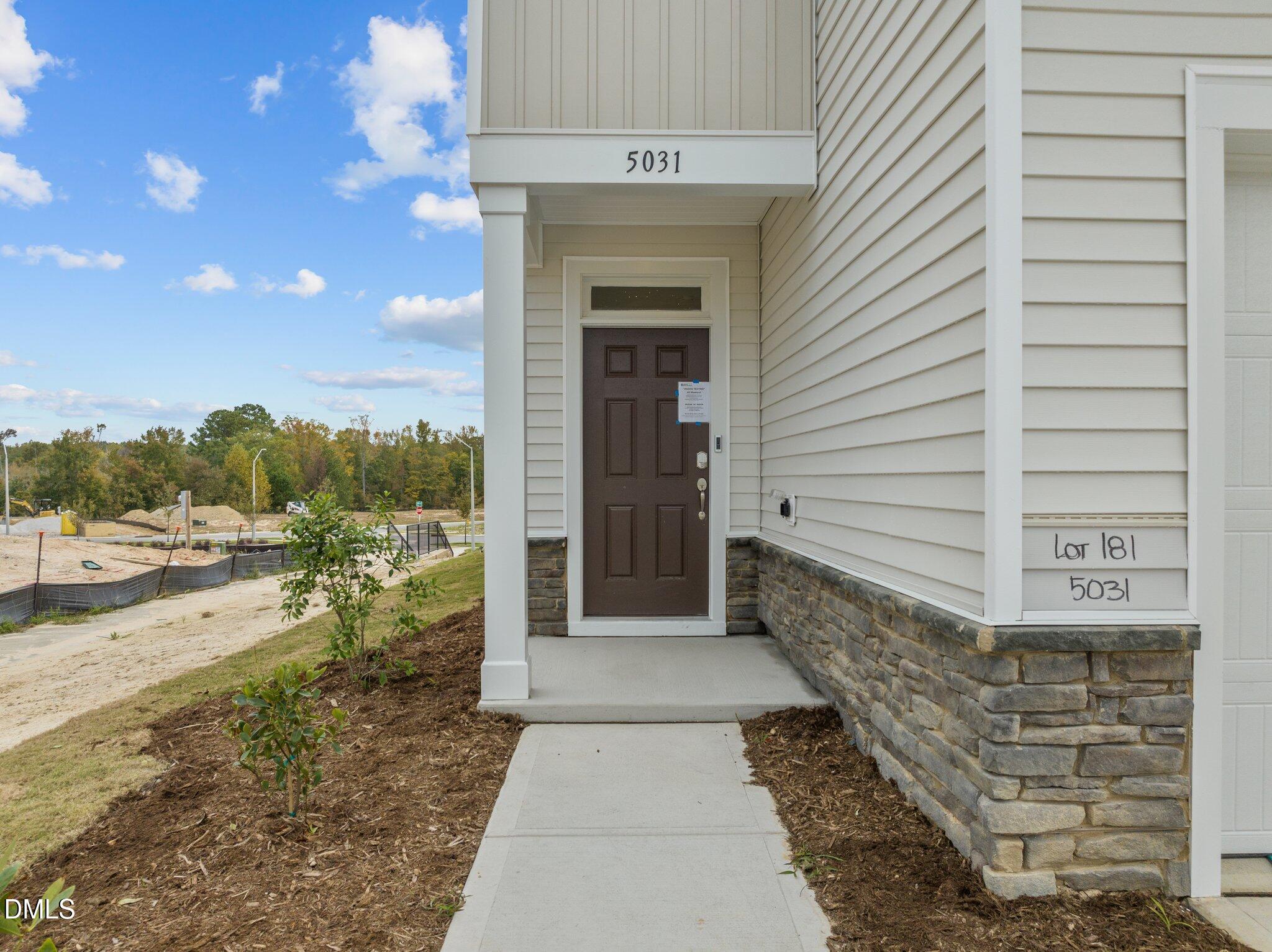 5031 Kota Street Raleigh, NC 27610 - Photo 2 of 84 a view of a pathway with a balcony