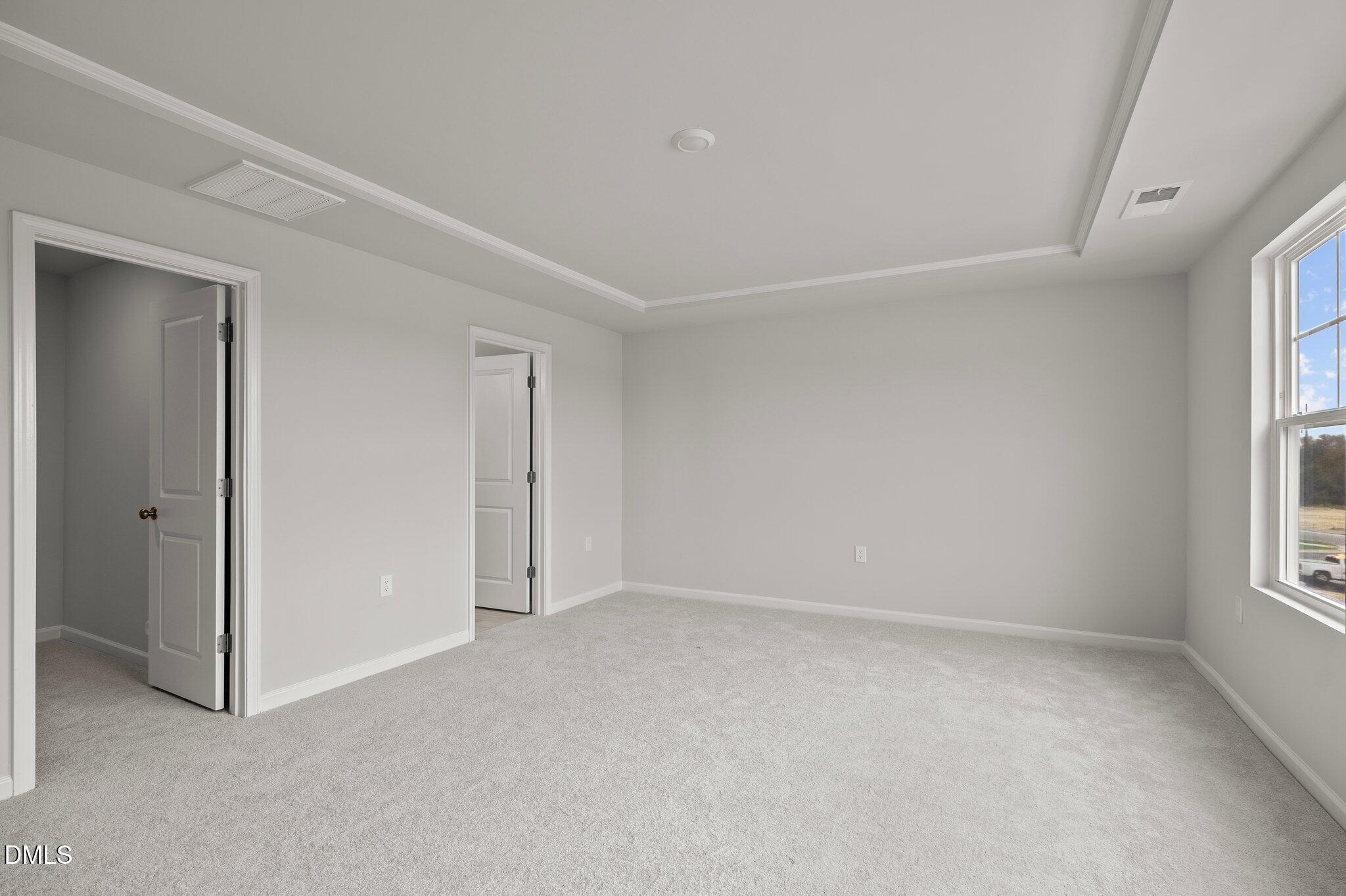 5031 Kota Street Raleigh, NC 27610 - Photo 29 of 84 an empty room with windows and closet