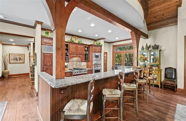 a bathroom with a sink a mirror and a shower