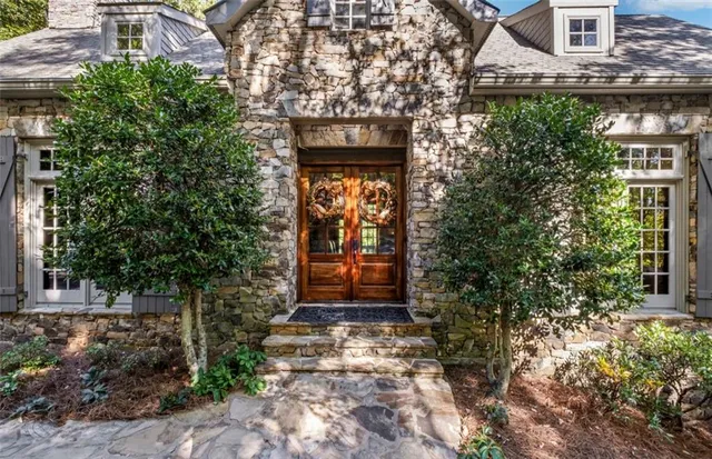 a kitchen with stainless steel appliances granite countertop a stove and a refrigerator