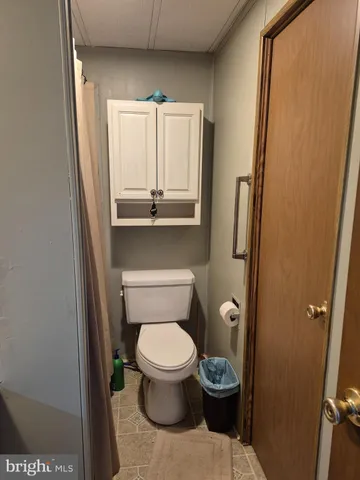 a bathroom with a toilet and a sink