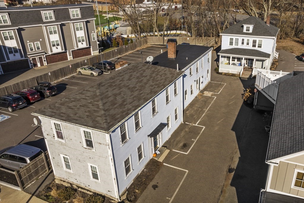 a aerial view of a house with parking space