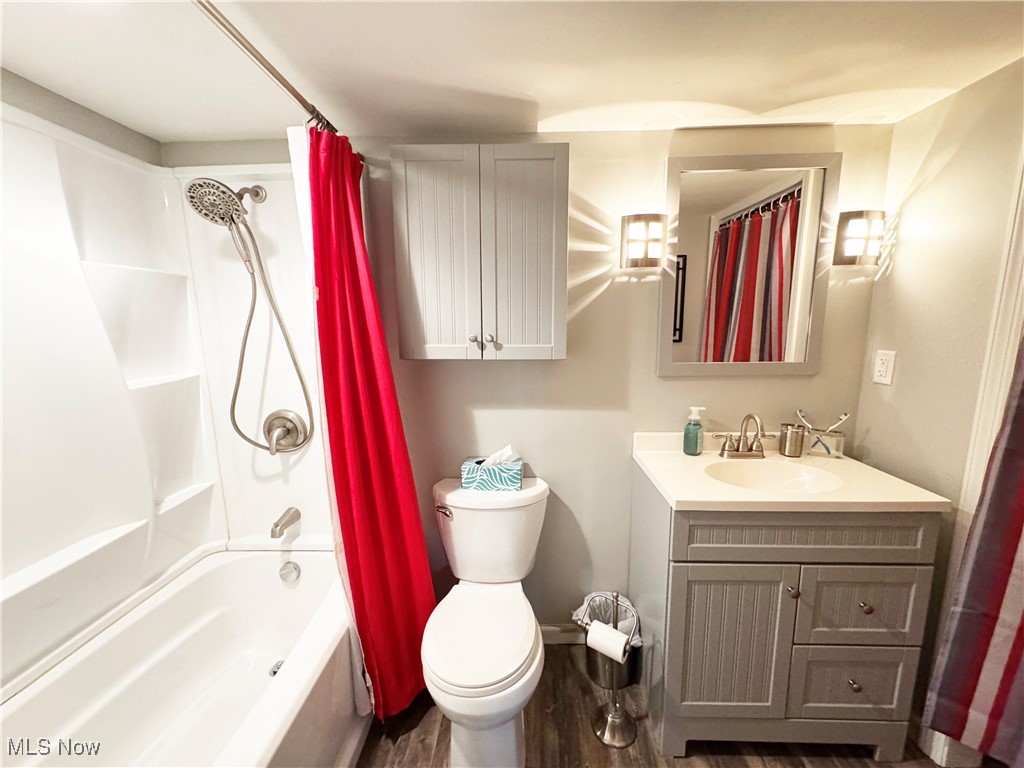 244 Barrington Ridge Road Painesville, OH 44077 - Photo 43 of 50 Bathroom with shower / bathtub combination with curtain, toilet, and vanity