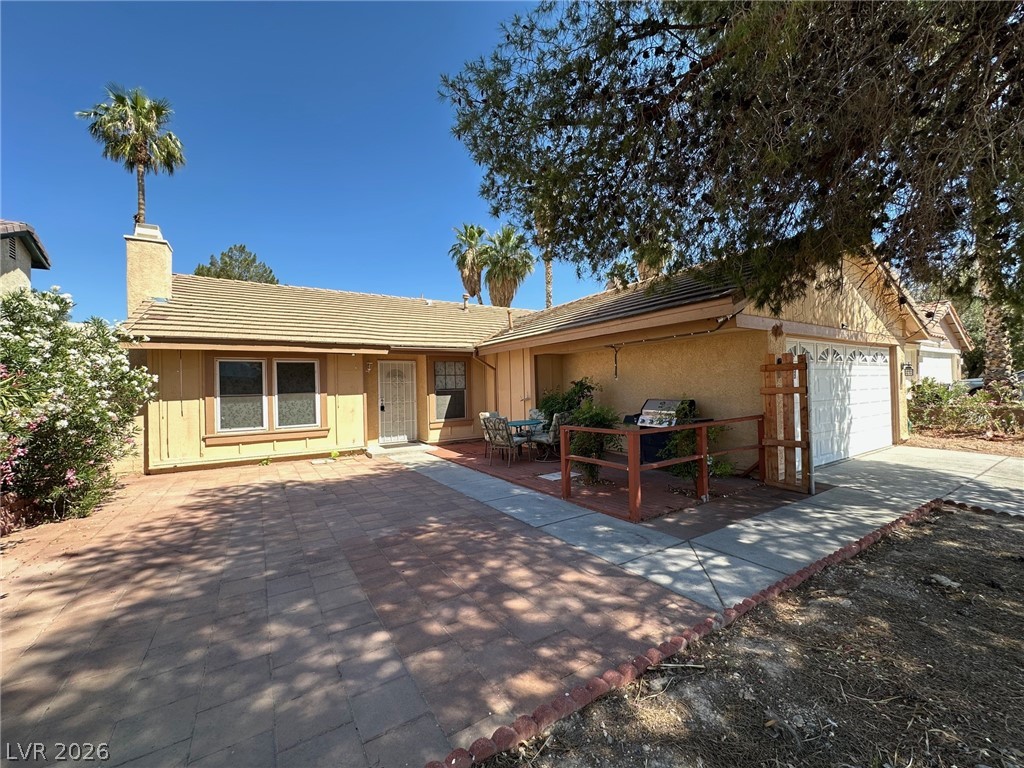 2340 Viewcrest Road Henderson, NV 89014 - Photo 2 of 36 This inviting home presents a warm facade with convenient outdoor living space.