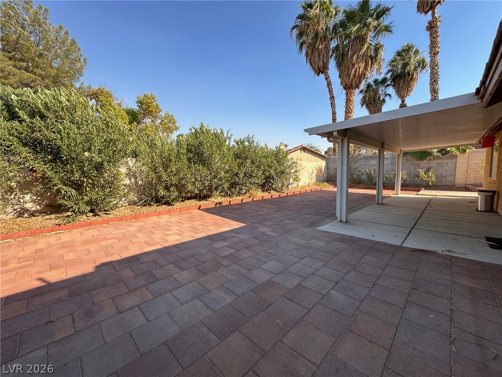 2340 Viewcrest Road Henderson, NV 89014 - Photo 31 of 36 This private yard features extensive pavers and a convenient covered patio perfect for outdoor enjoyment.