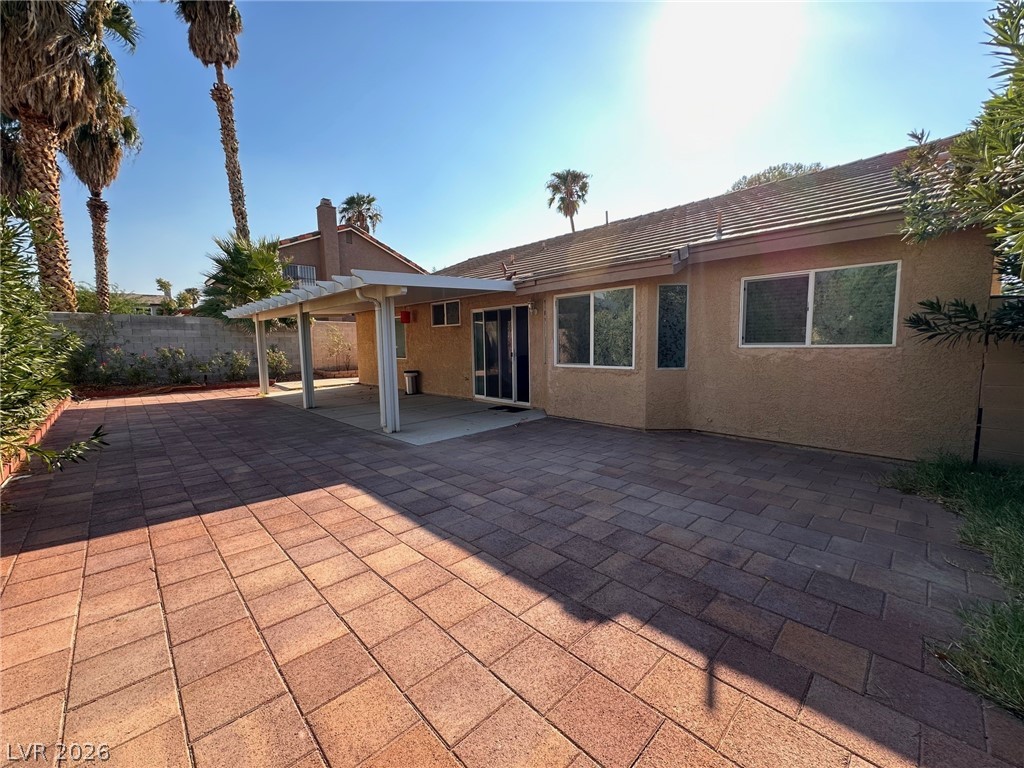 2340 Viewcrest Road Henderson, NV 89014 - Photo 32 of 36 This private backyard oasis features an expansive paved patio perfect for outdoor enjoyment.