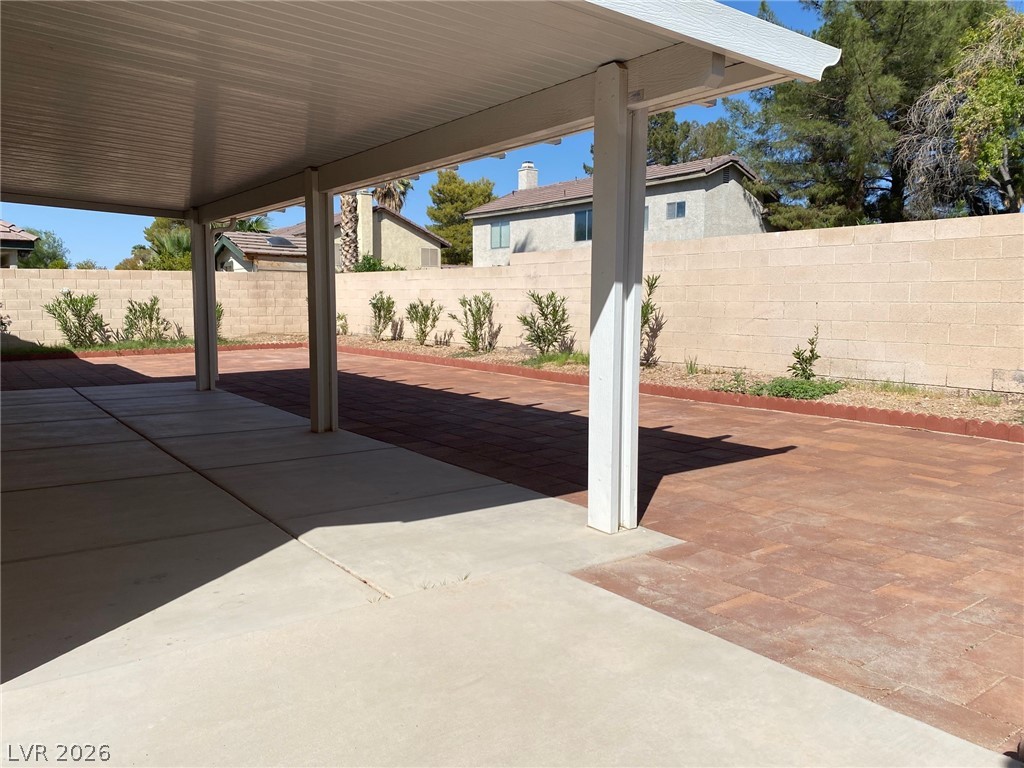 2340 Viewcrest Road Henderson, NV 89014 - Photo 33 of 36 This spacious outdoor area features a covered patio, ideal for relaxation and entertaining.