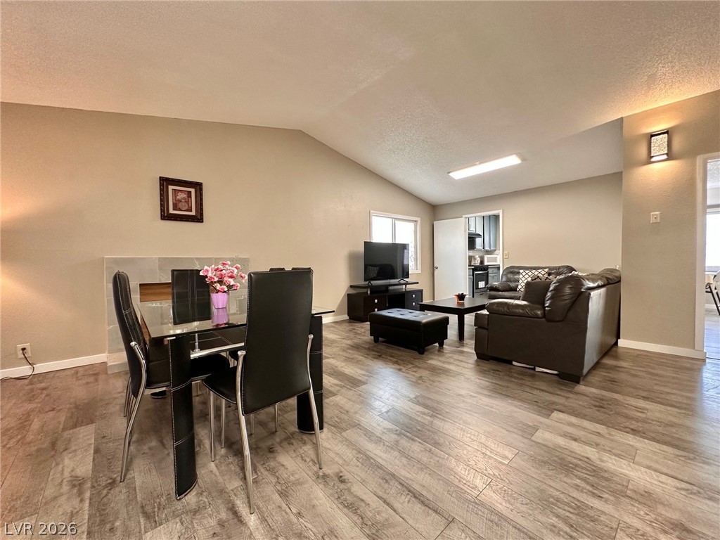 2340 Viewcrest Road Henderson, NV 89014 - Photo 4 of 36 This inviting space features a vaulted ceiling and elegant flooring, ideal for comfortable living.
