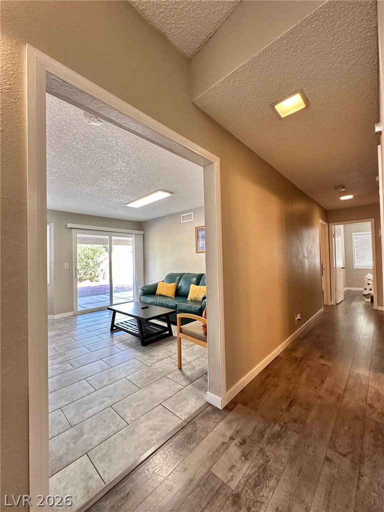 2340 Viewcrest Road Henderson, NV 89014 - Photo 9 of 36 This inviting interior features a harmonious blend of flooring, offering comfort and style.
