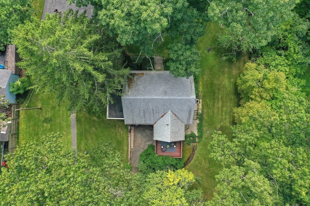 553 Winter Street Walpole, MA 02081 - Photo 11 of 42 an aerial view of a house with pool and trees all around